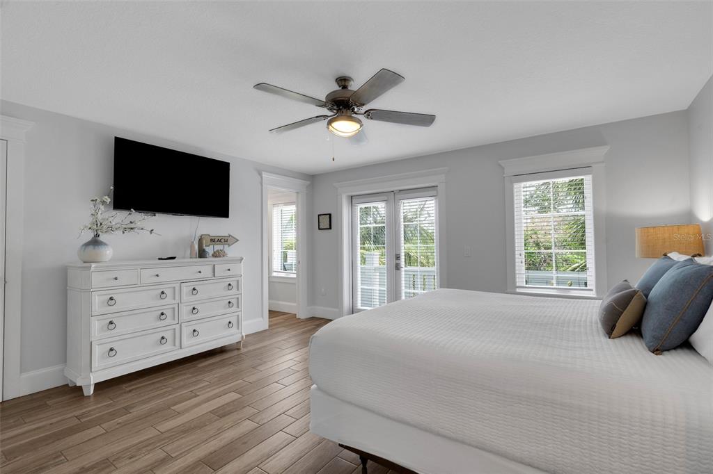 538 Canal Road Sarasota, FL 34242 - Photo 36 of 49 a bedroom with a bed and a flat screen tv