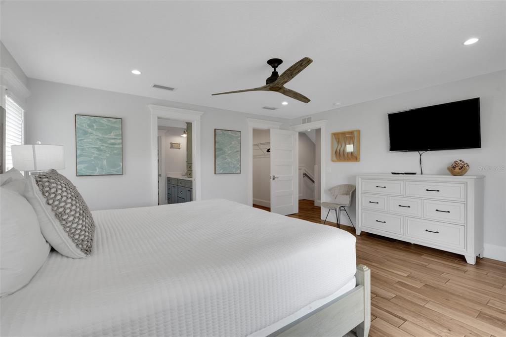 538 Canal Road Sarasota, FL 34242 - Photo 37 of 49 a bedroom with a bed and a flat screen tv