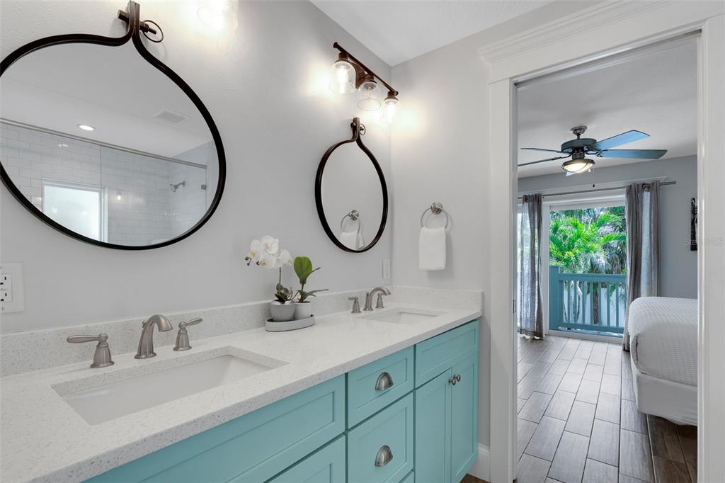 538 Canal Road Sarasota, FL 34242 - Photo 41 of 49 a bathroom with a double vanity sink and a mirror