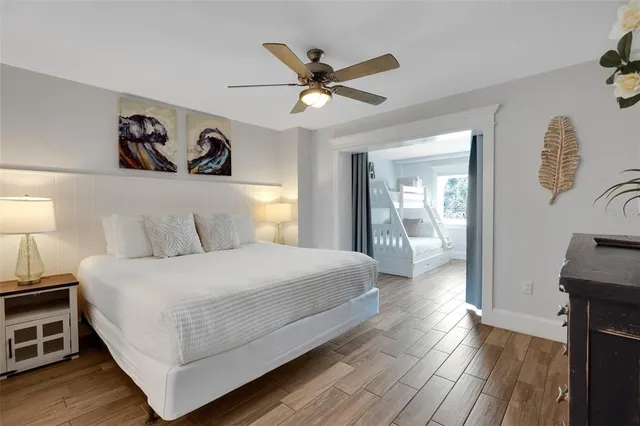 a bedroom with a bed and a table