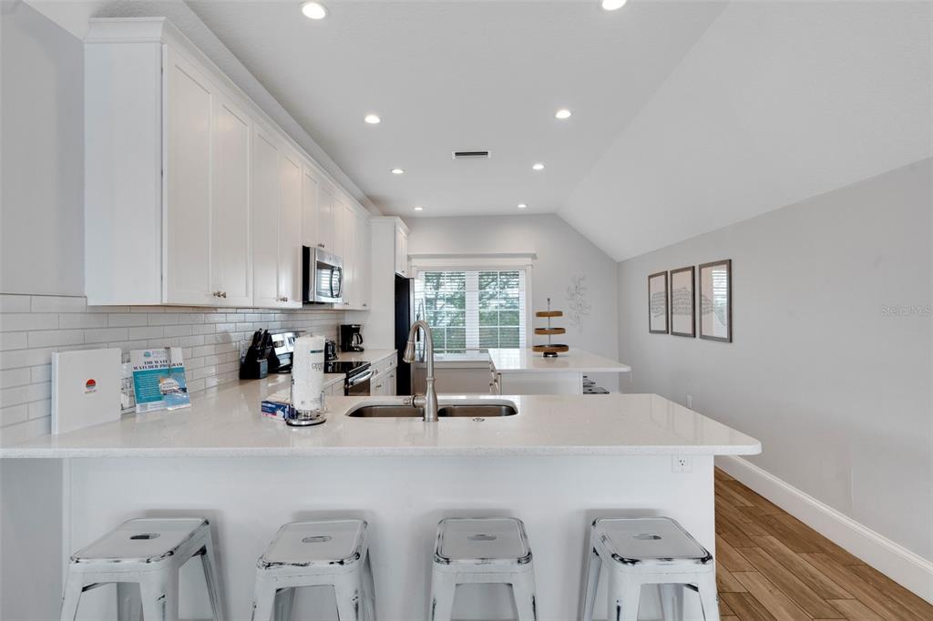 538 Canal Road Sarasota, FL 34242 - Photo 6 of 49 a kitchen with counter top space cabinets and window