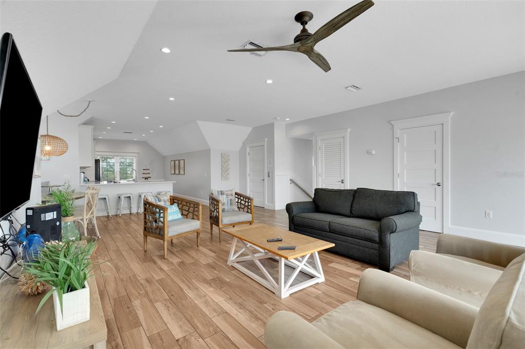 538 Canal Road Sarasota, FL 34242 - Photo 7 of 49 a living room with furniture and a flat screen tv