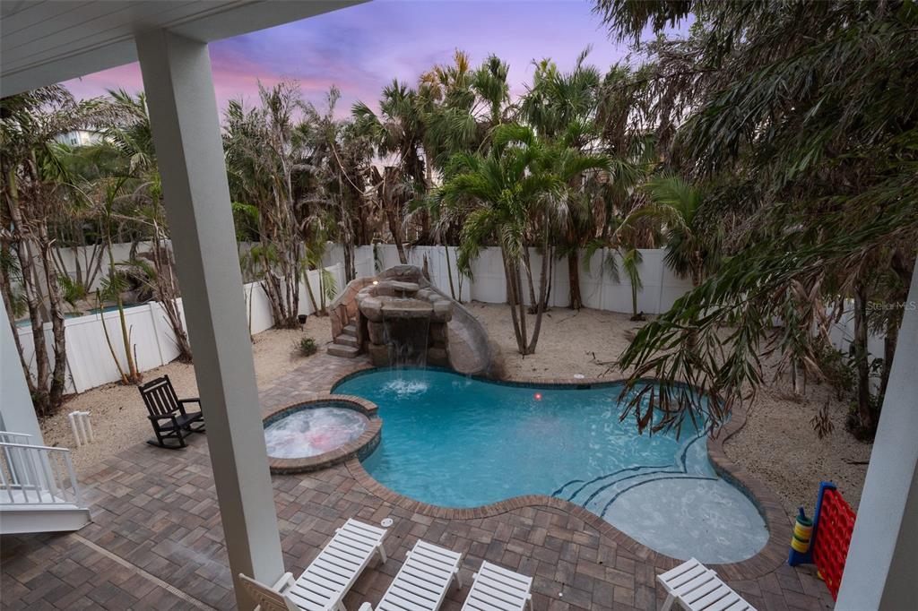 538 Canal Road Sarasota, FL 34242 - Photo 8 of 49 a backyard of a house with fire pit and outdoor seating