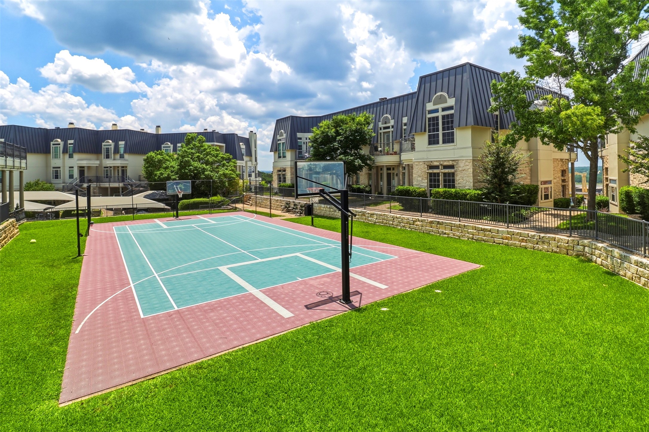 2918 Ranch Road 620, Unit 265 Austin, TX 78734 - Photo 25 of 40 An outdoor sport court with ample green space offers recreational opportunities.