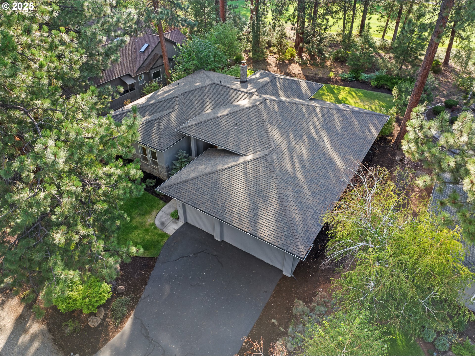 60799 Currant Way Bend, OR 97702 - Photo 26 of 28 an aerial view of a house with a yard basket ball court and outdoor seating