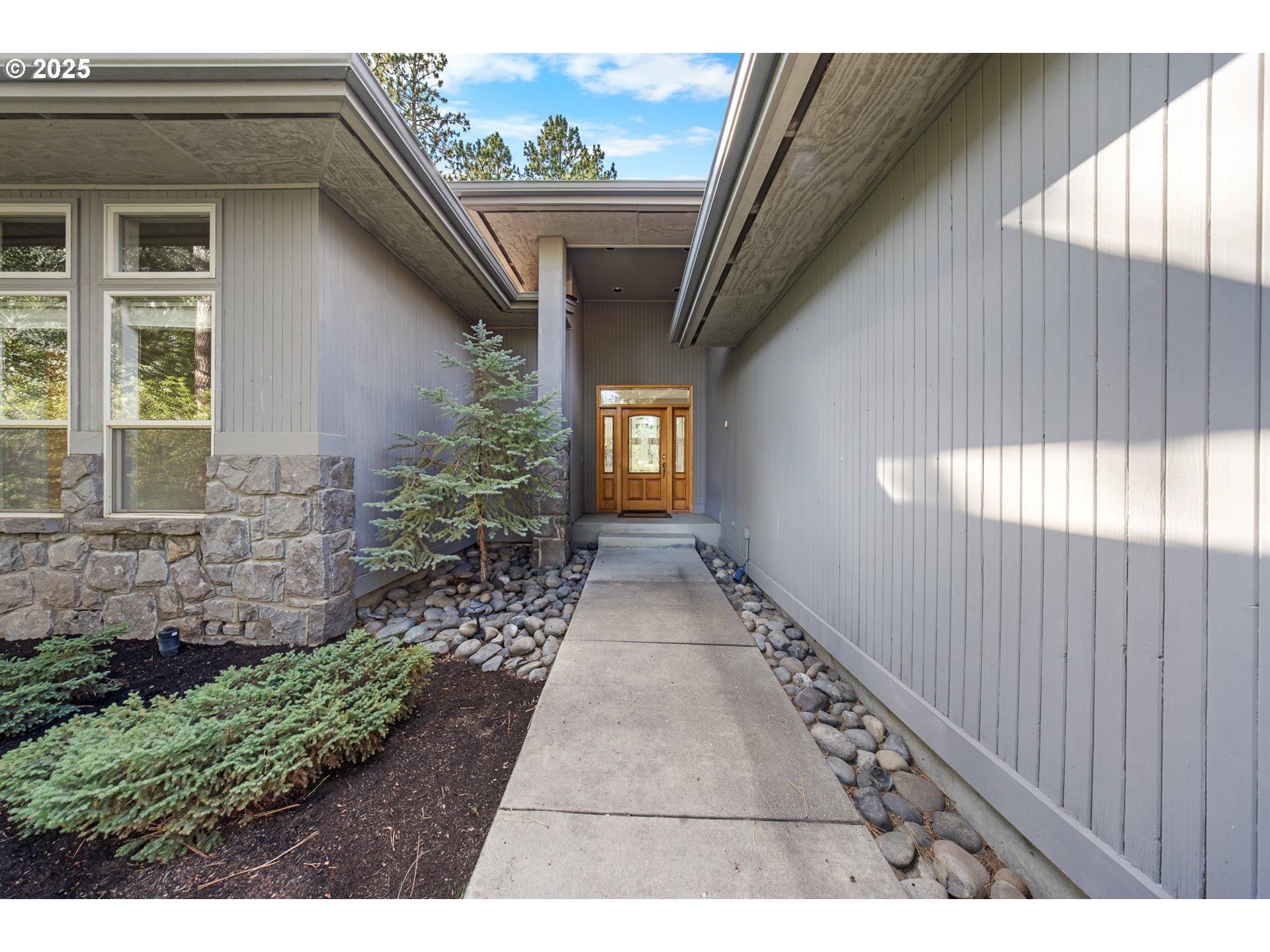 60799 Currant Way Bend, OR 97702 - Photo 4 of 28 a view of entryway with a yard