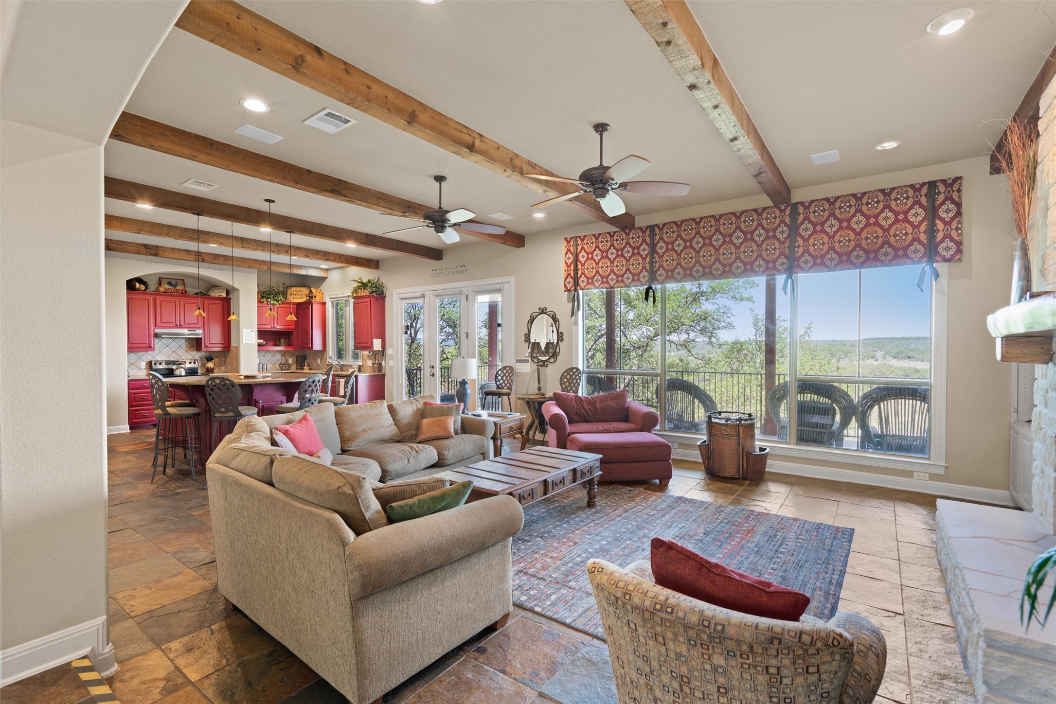 1017 Coventry Road Spicewood, TX 78669 - Photo 1 of 43 a living room with furniture and a large window