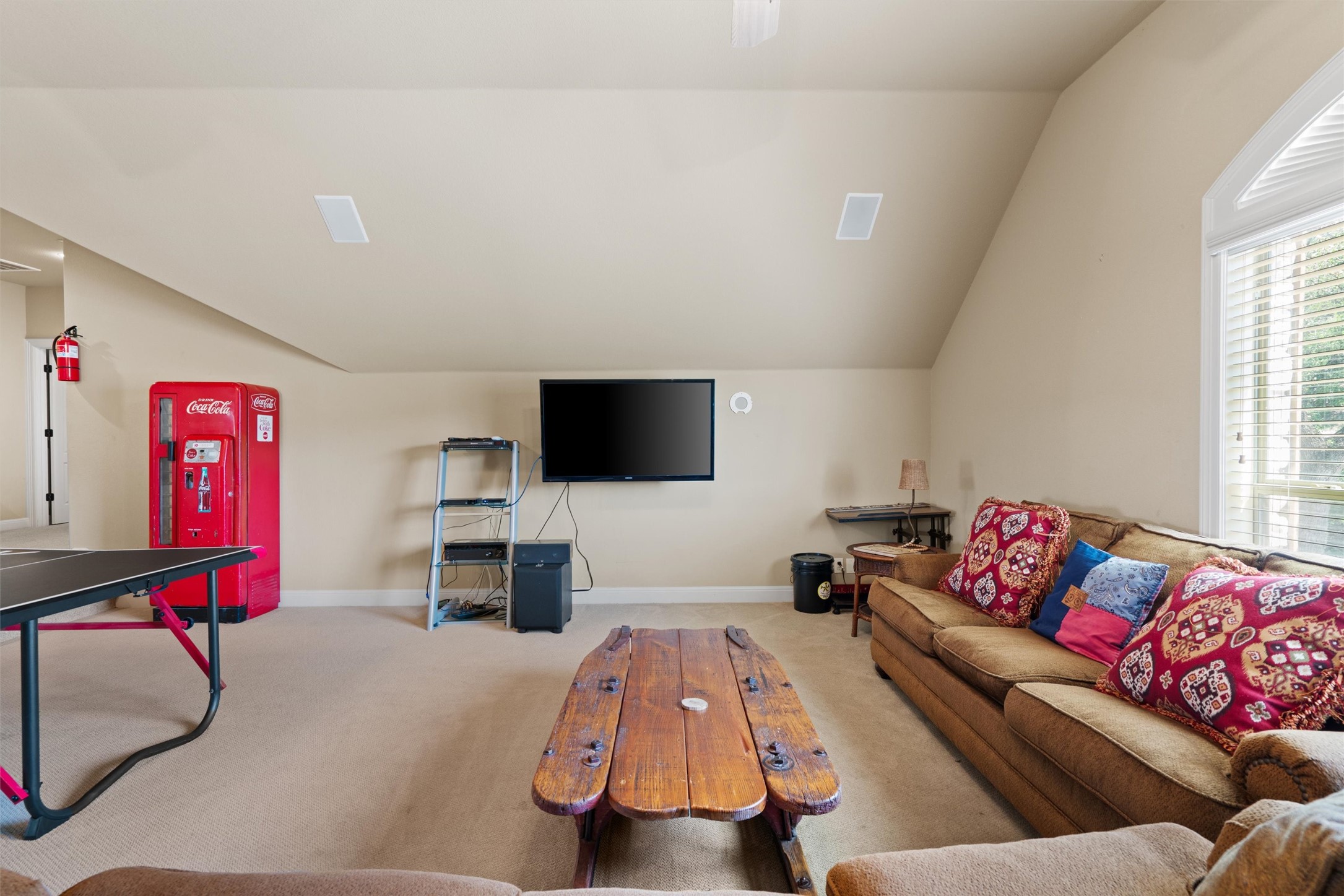 1017 Coventry Road Spicewood, TX 78669 - Photo 23 of 43 a living room with furniture and a flat screen tv
