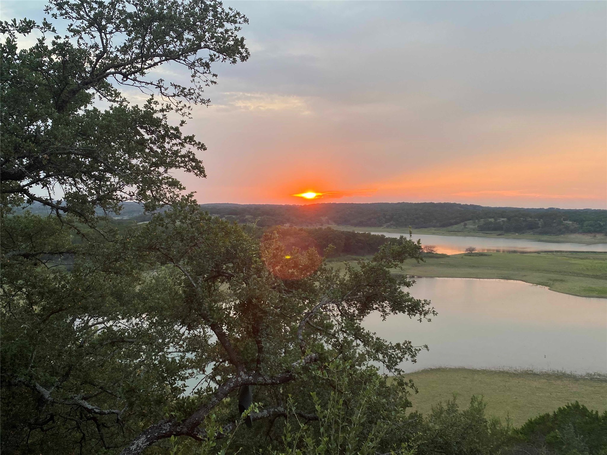 1017 Coventry Road Spicewood, TX 78669 - Photo 3 of 43 a view of lake with green space