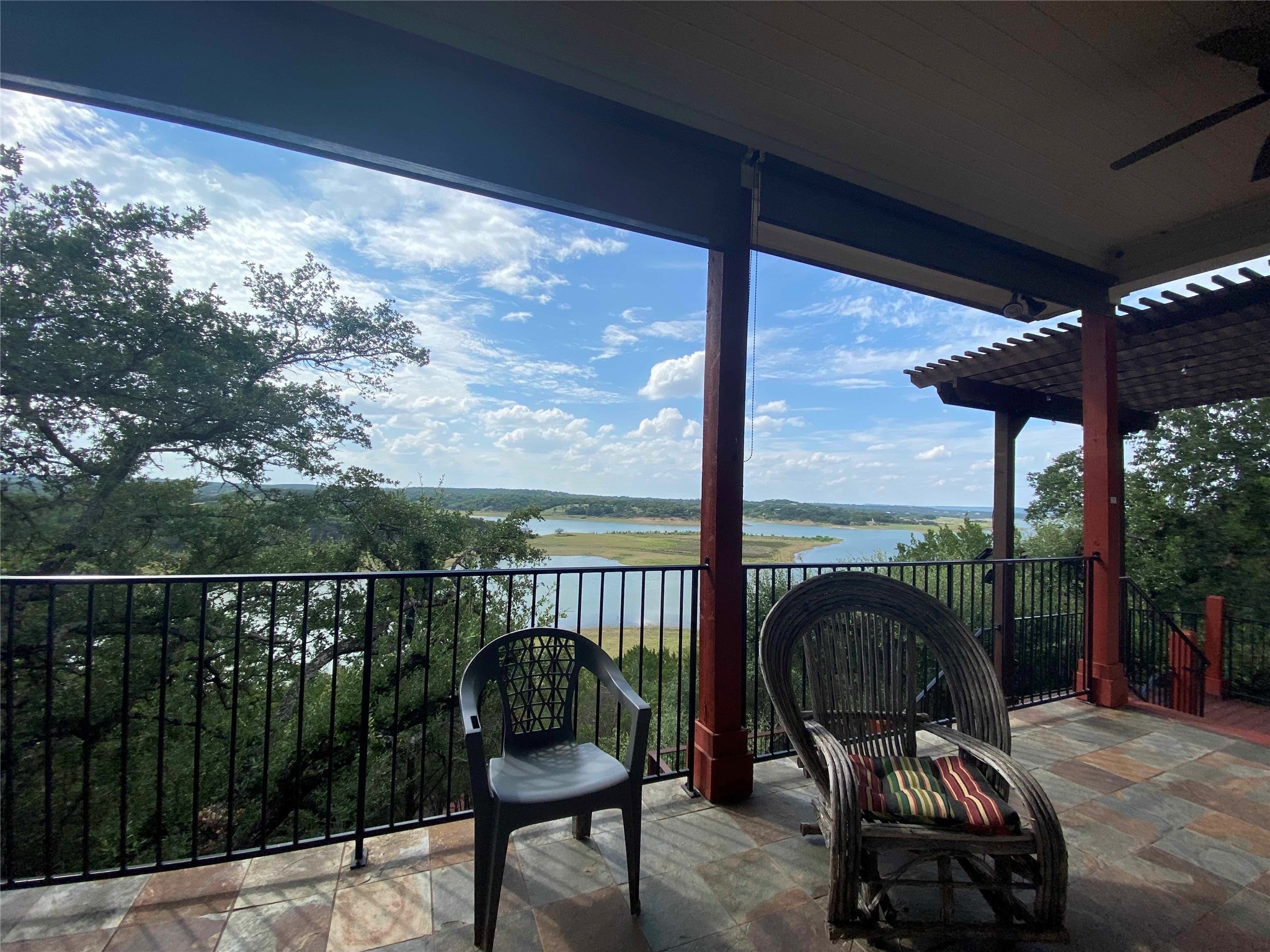 1017 Coventry Road Spicewood, TX 78669 - Photo 34 of 43 a couple of chairs sitting in balcony with lamp