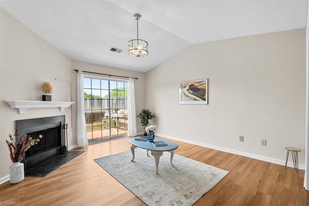 814 Guilford College Road, Unit 133 Greensboro, NC 27409 - Photo 3 of 18 Living room with vaulted ceiling