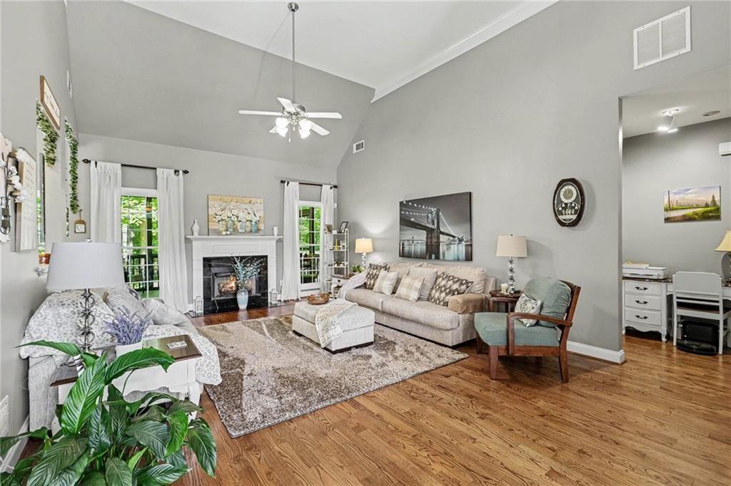3792 Falls Trail Winston, GA 30187 - Photo 5 of 33 a living room with furniture a fireplace and a table