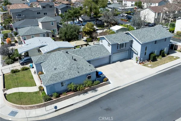 an aerial view of a house with outdoor space
