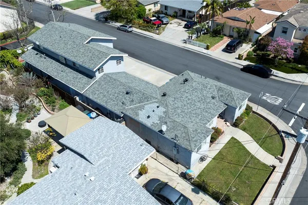 an aerial view of a house with a yard
