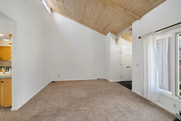 a kitchen with kitchen island a counter top space a sink stainless steel appliances and cabinets