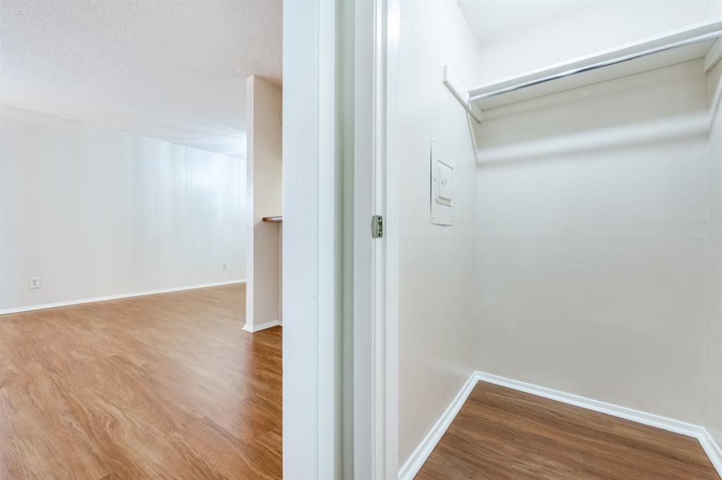 12830 Midway Road, Unit 1120 Dallas, TX 75244 - Photo 4 of 14 a view of a room with wooden floor