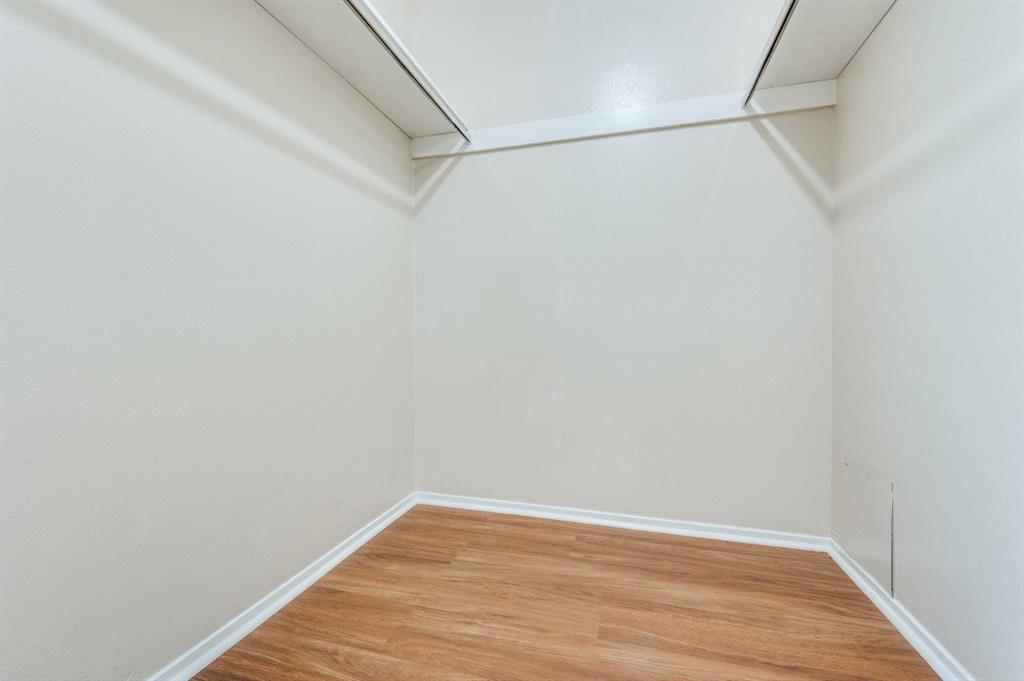 12830 Midway Road, Unit 1120 Dallas, TX 75244 - Photo 10 of 14 a view of a room with wooden floor