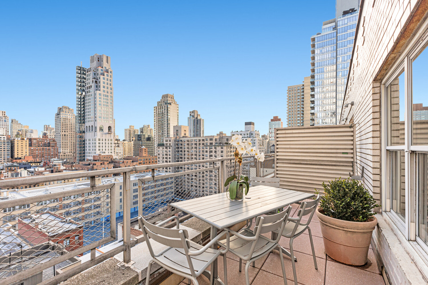 207 East 74th Street, Unit PHG Manhattan, NY 10021 - Photo 11 of 12 a view of a city with tall buildings