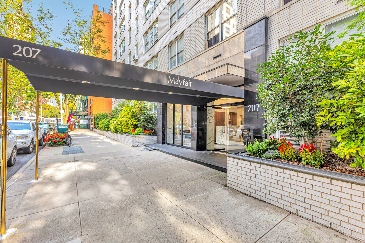 207 East 74th Street, Unit PHG Manhattan, NY 10021 - Photo 2 of 12 a view of a patio with table and chairs and potted plants