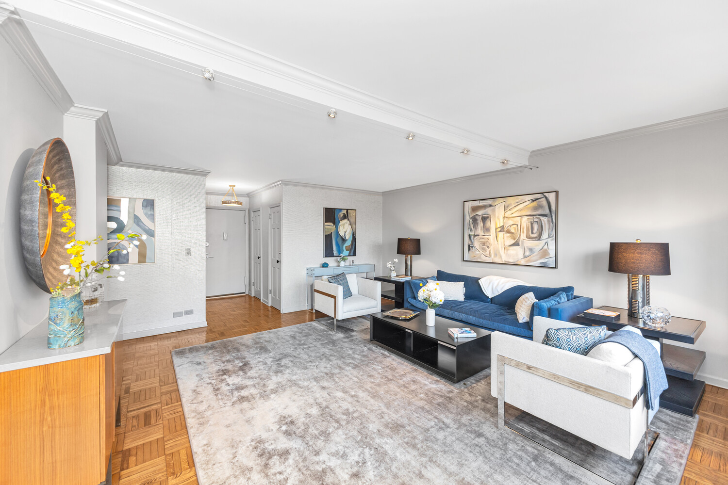 207 East 74th Street, Unit PHG Manhattan, NY 10021 - Photo 5 of 12 a living room with furniture and a flat screen tv