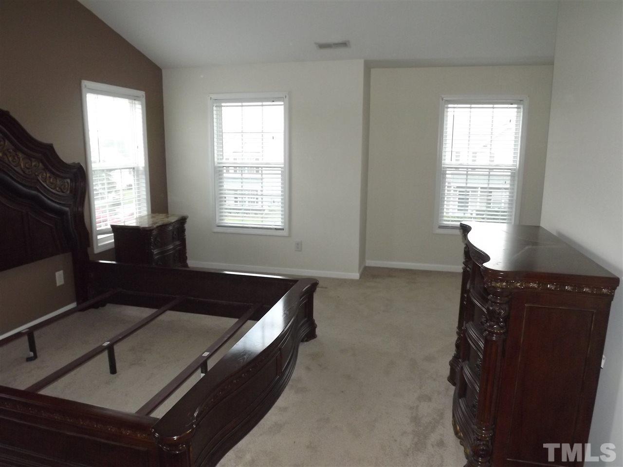 7032 Spanglers Spring Way Raleigh, NC 27610 - Photo 15 of 25 a living room with furniture and a flat screen tv