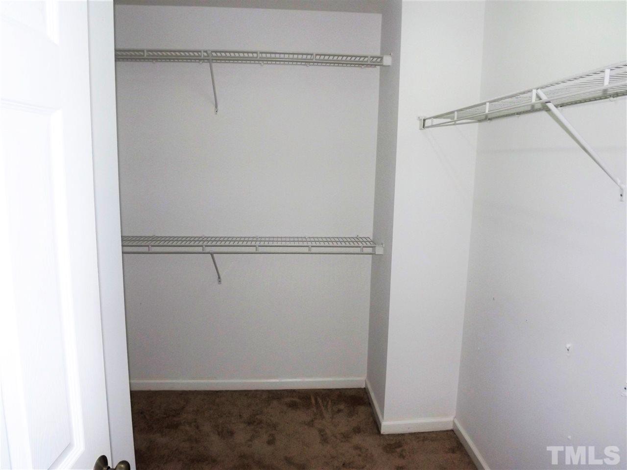 7032 Spanglers Spring Way Raleigh, NC 27610 - Photo 18 of 25 a view of an empty walk in closet