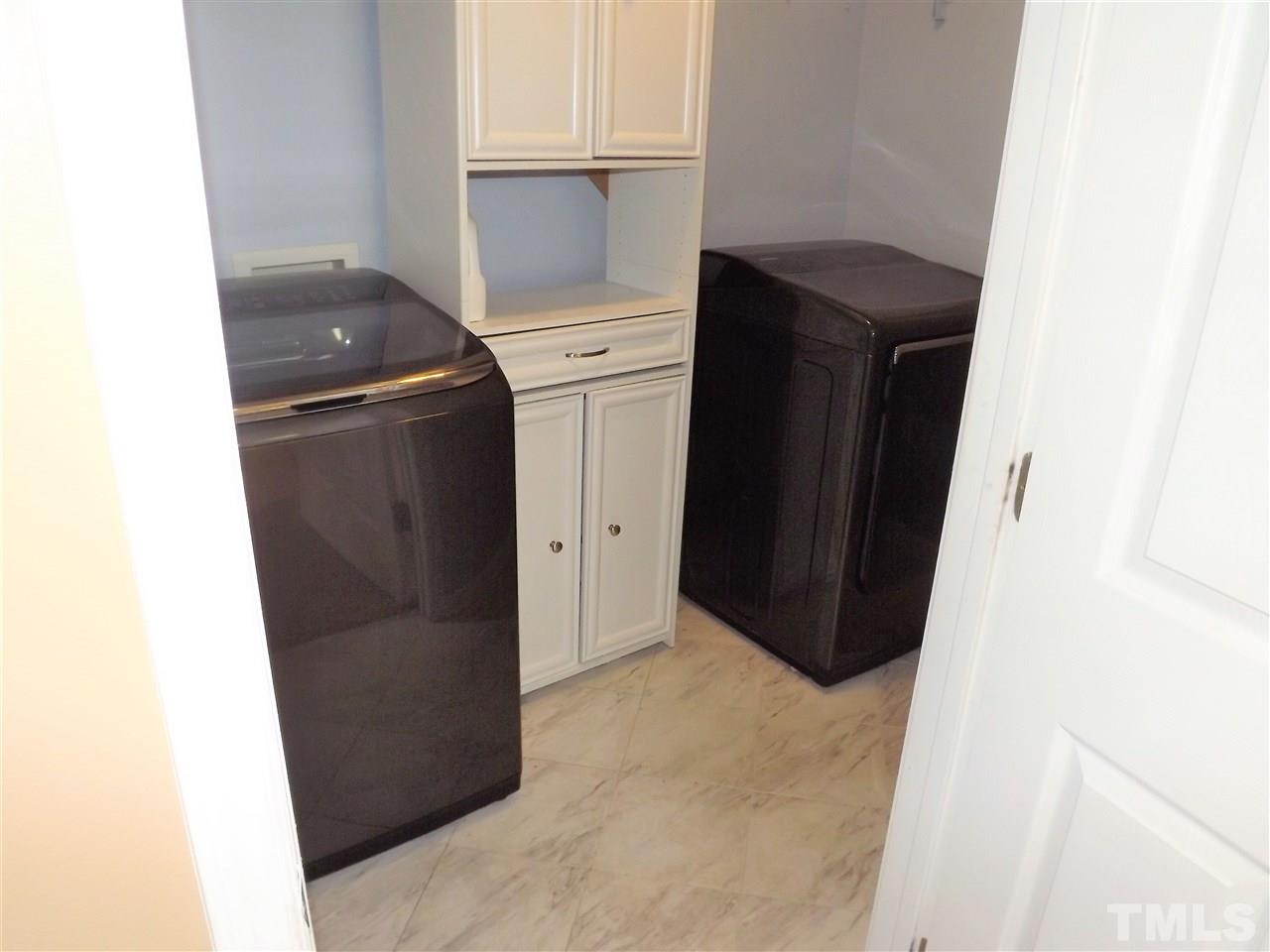 7032 Spanglers Spring Way Raleigh, NC 27610 - Photo 25 of 25 a utility room with dryer and washer