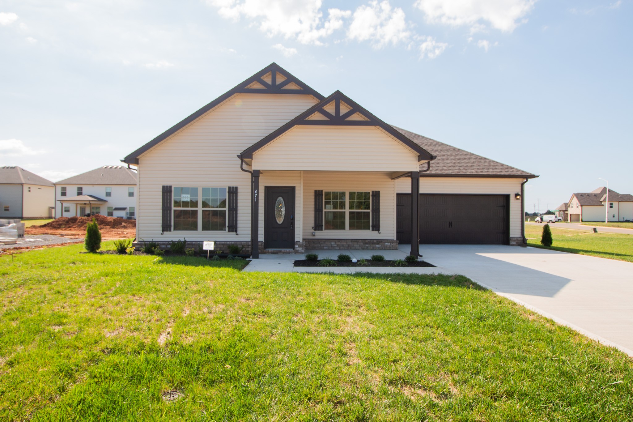 a view of a house with swimming pool and a yard