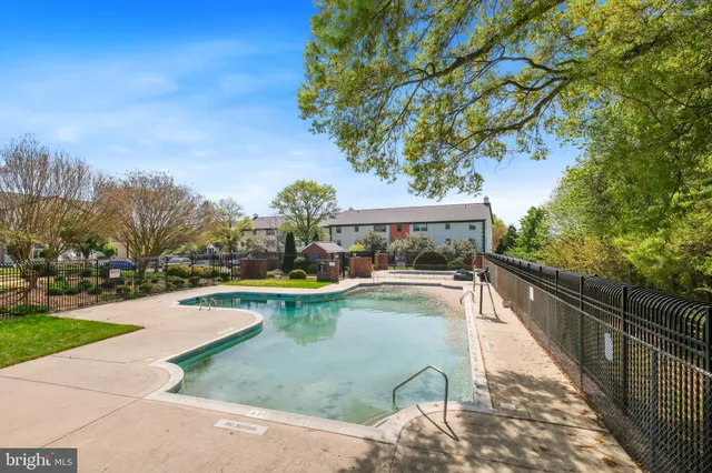 a view of swimming pool with seating space