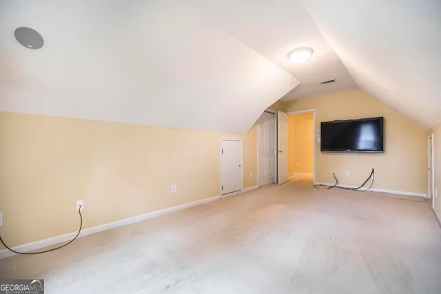 a view of an empty room with a flat screen tv