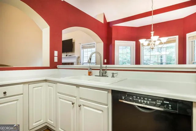 a stove top oven sitting inside of a kitchen