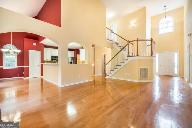 a view of livingroom with kitchen and fireplace