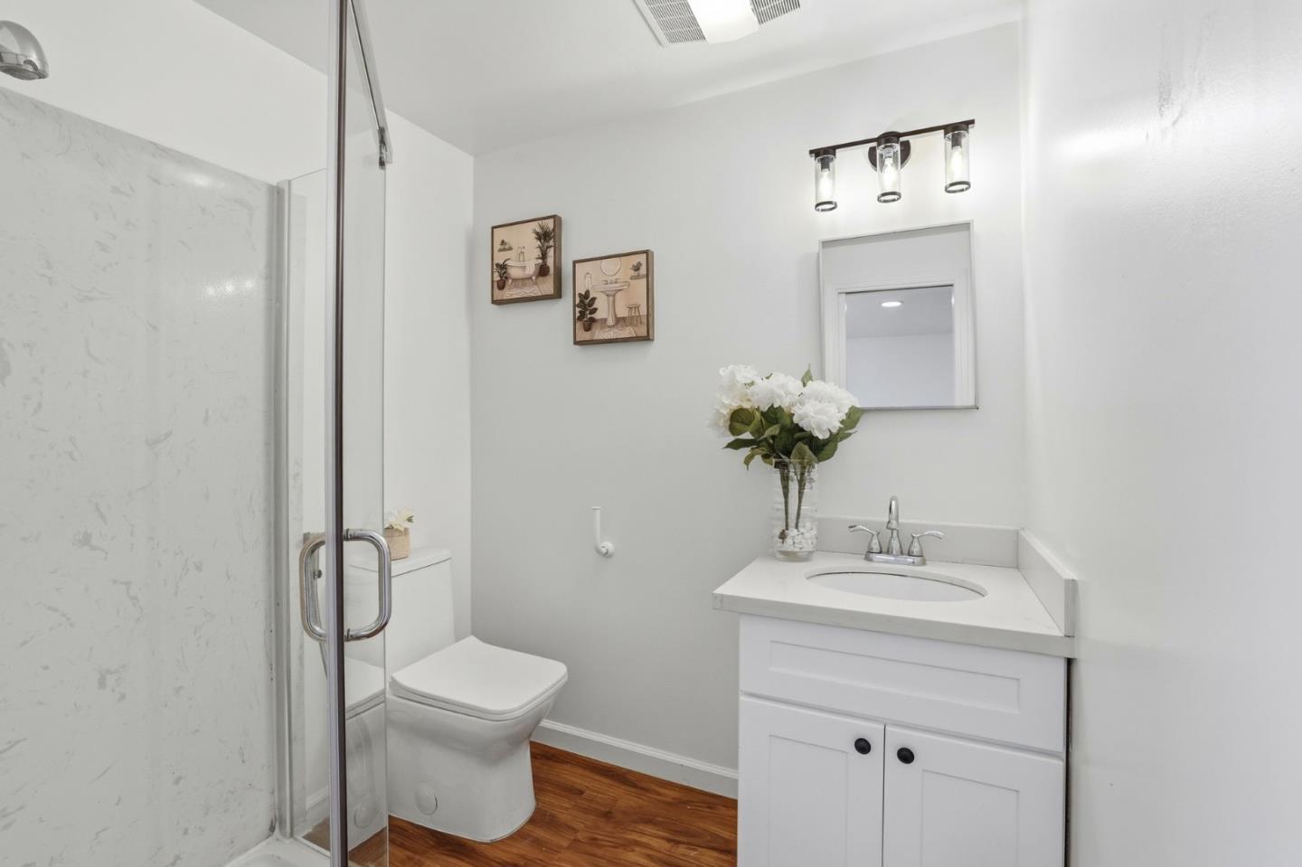 555 Umbarger Road, Unit 31 San Jose, CA 95111 - Photo 13 of 18 a bathroom with a toilet sink and mirror