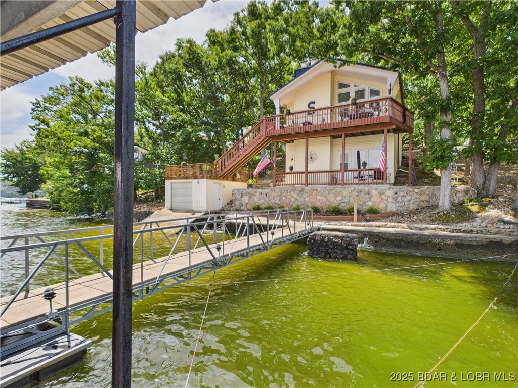 30089 Gresham Road Gravois Mills, MO 65037 - Photo 47 of 52 Rear view of the home in the Summer.