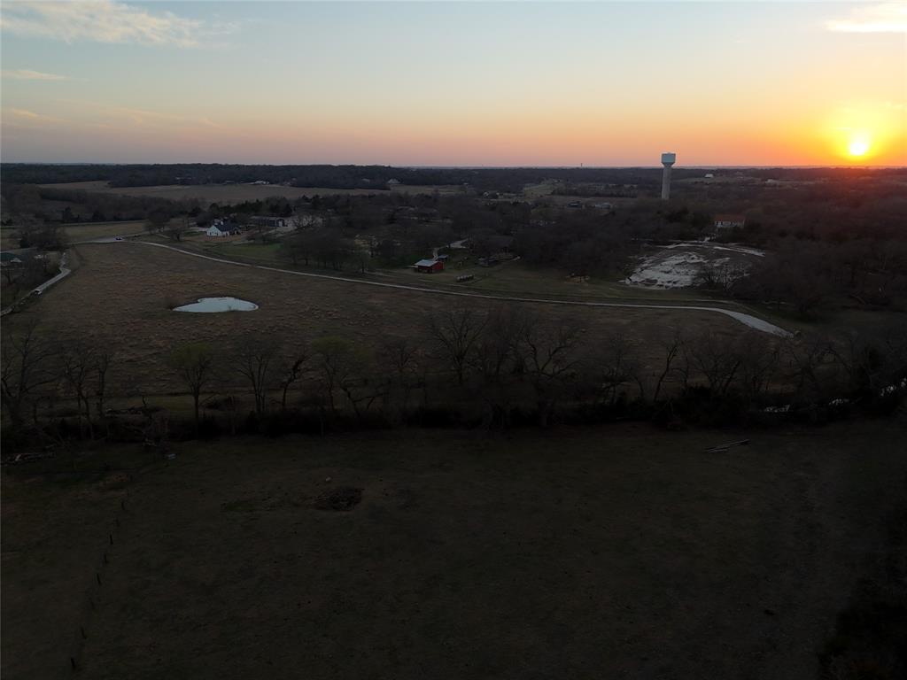 3891 Bethel-Cannon Road Van Alstyne, TX 75495 - Photo 8 of 16 a view of a city next to a yard