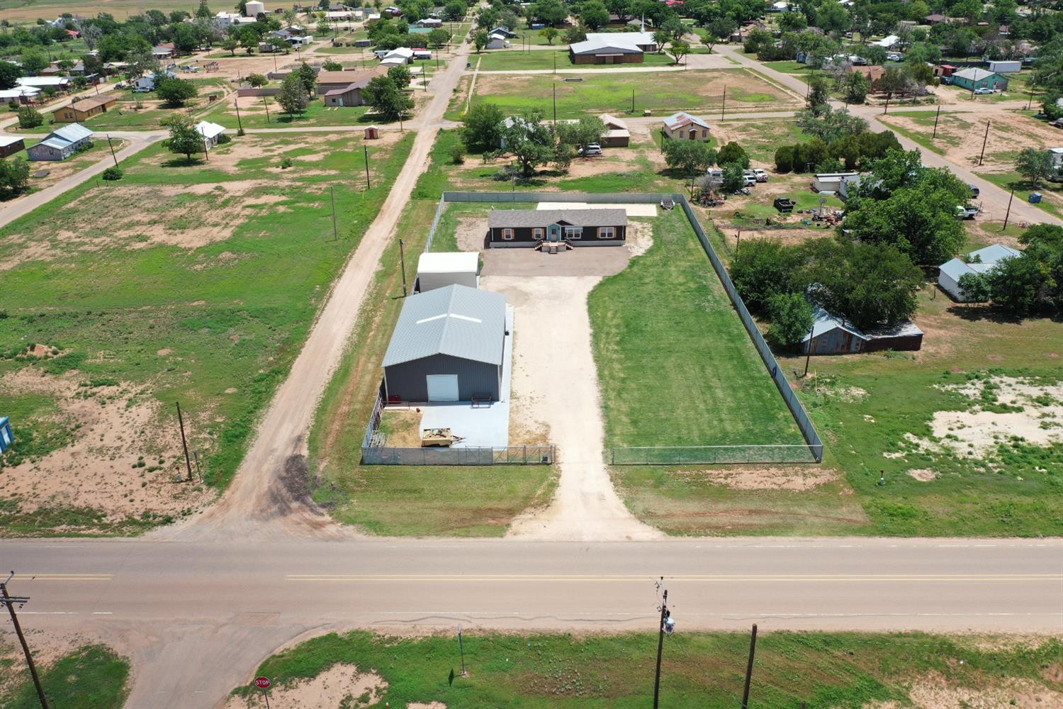 403 Geisler Quitaque, TX 79255 - Photo 1 of 26 an aerial view of a house with a yard and lake view