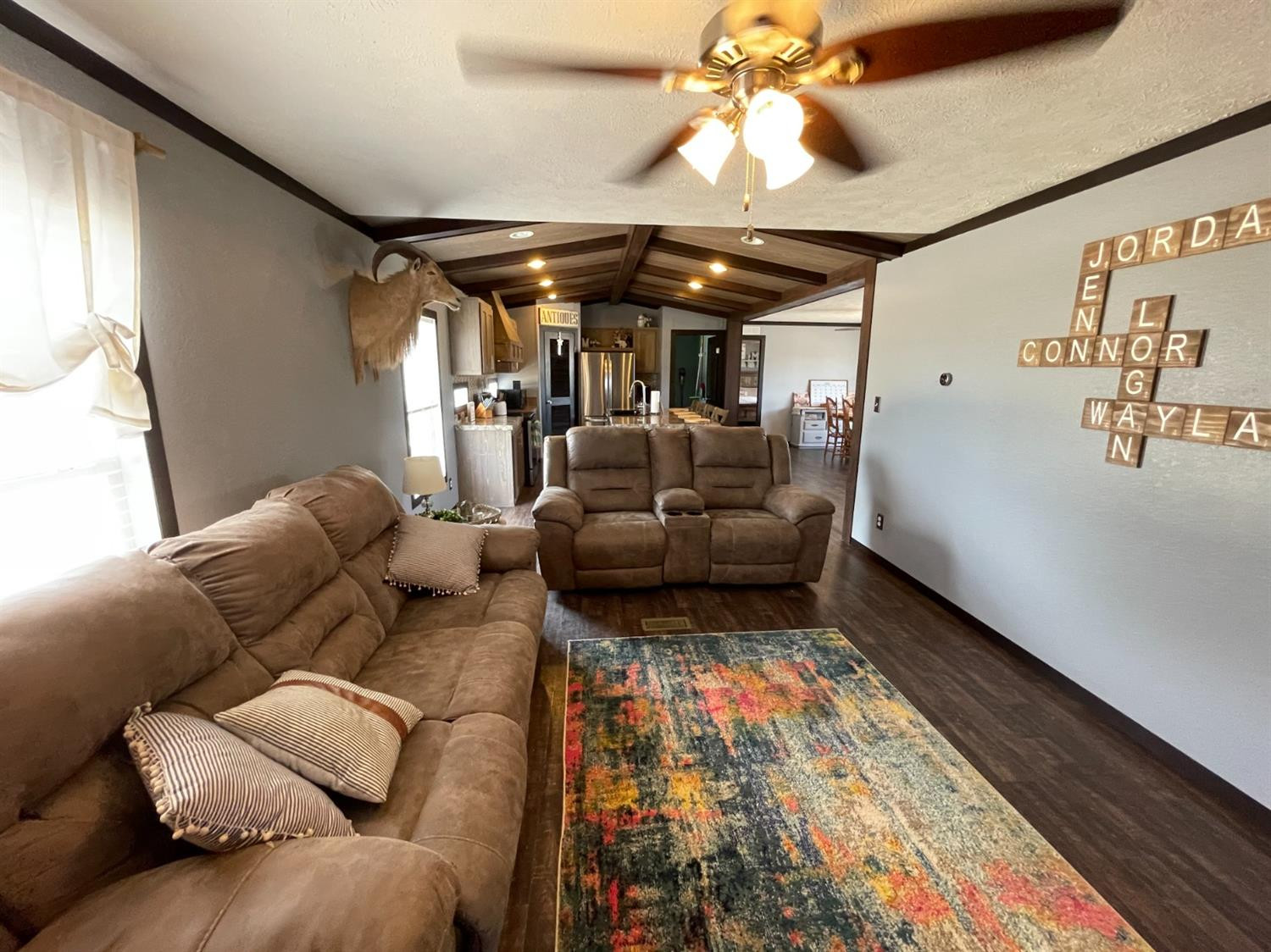 403 Geisler Quitaque, TX 79255 - Photo 15 of 26 a living room with furniture and a chandelier