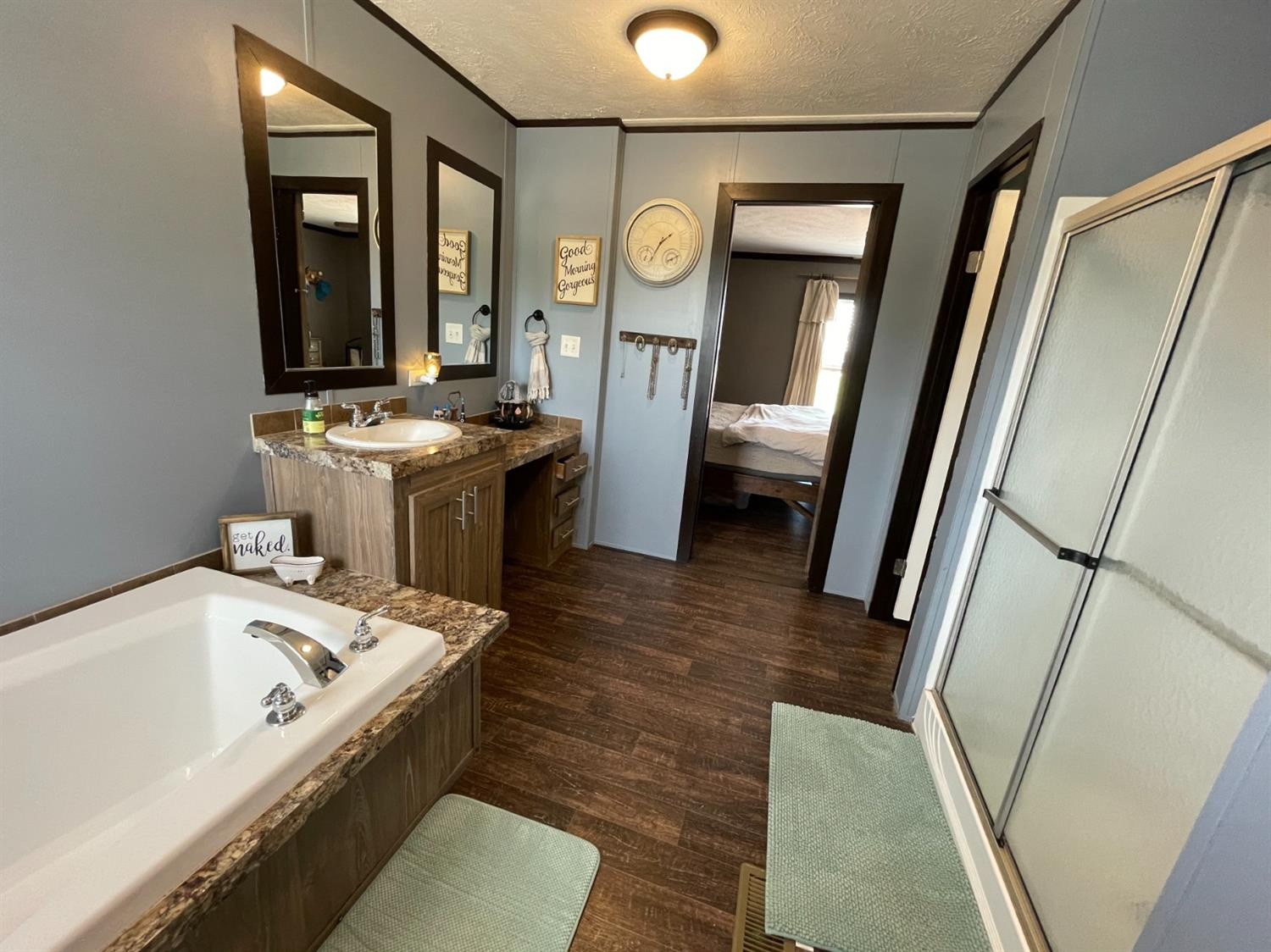 403 Geisler Quitaque, TX 79255 - Photo 18 of 26 a bathroom with a bathtub a sink and a mirror
