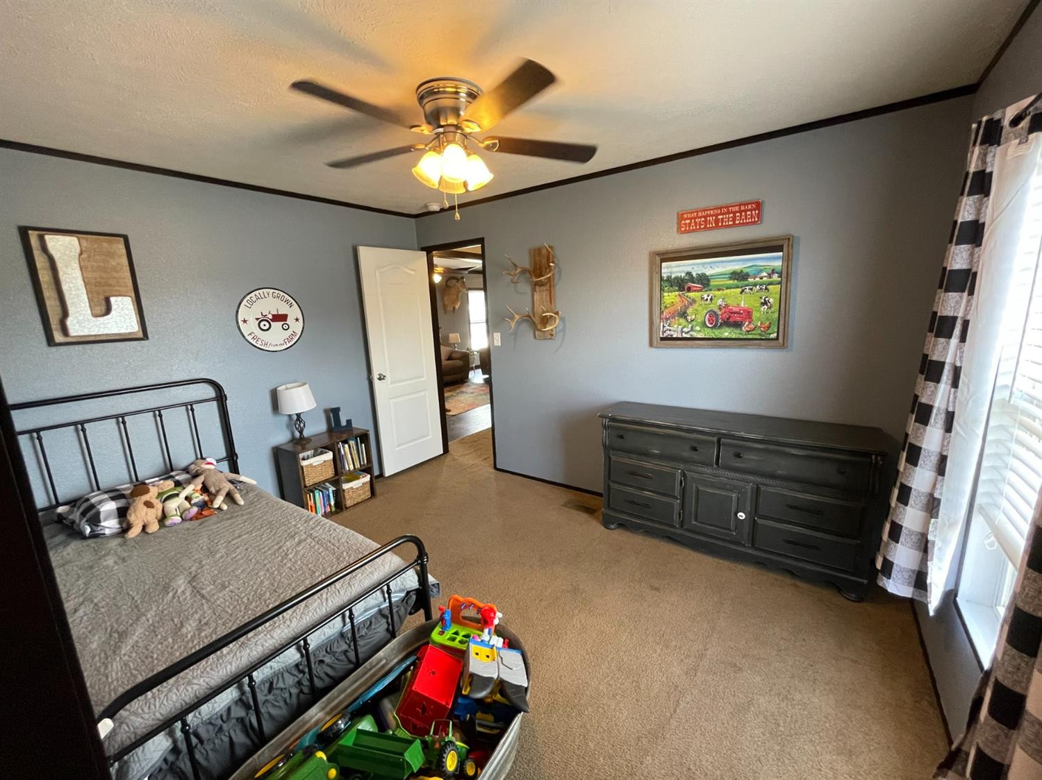 403 Geisler Quitaque, TX 79255 - Photo 22 of 26 a bedroom with furniture and paintings on the wall