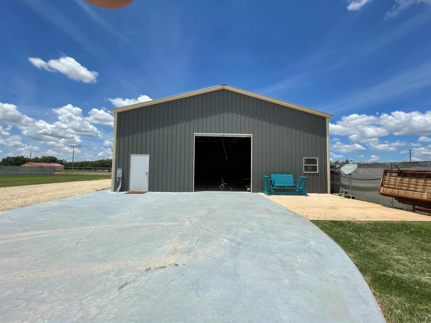 403 Geisler Quitaque, TX 79255 - Photo 7 of 26 a front view of a house with a yard and garage