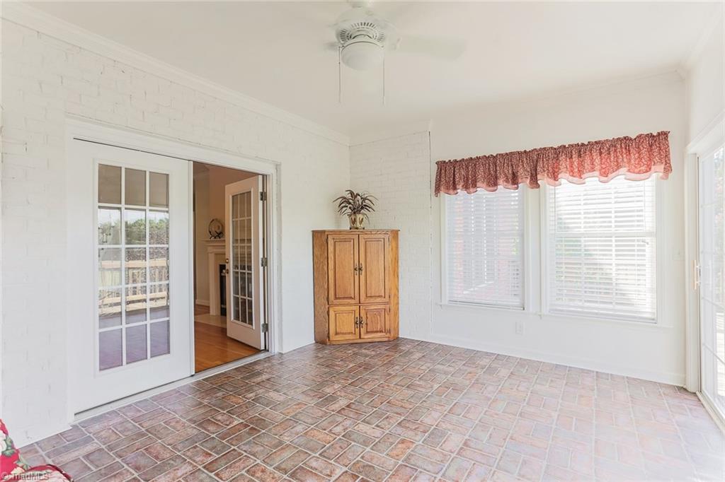 518 Hartman Road Winston-Salem, NC 27127 - Photo 22 of 30 French doors leading from breakfast room to sunroom.