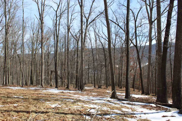 a view of wooden fence next to a building