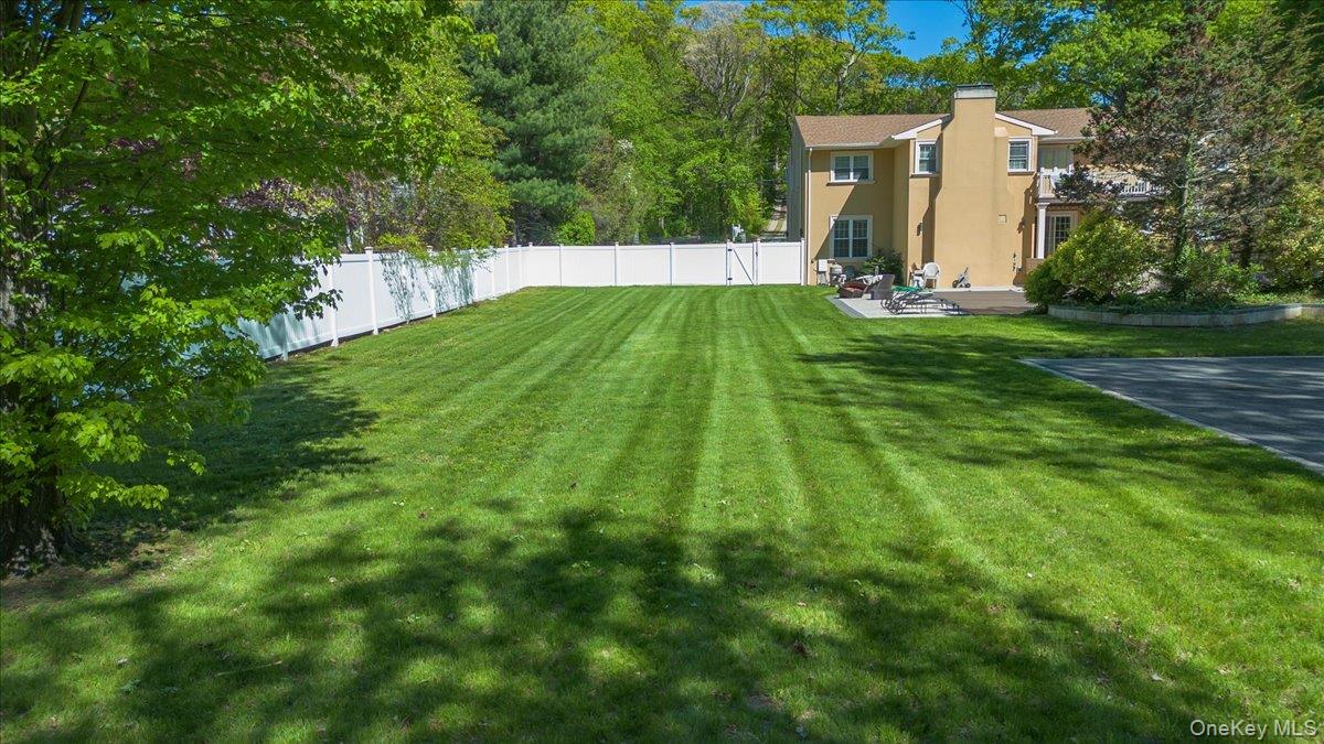 626 Caledonia Road Dix Hills, NY 11746 - Photo 38 of 49 a view of an house with backyard and trees