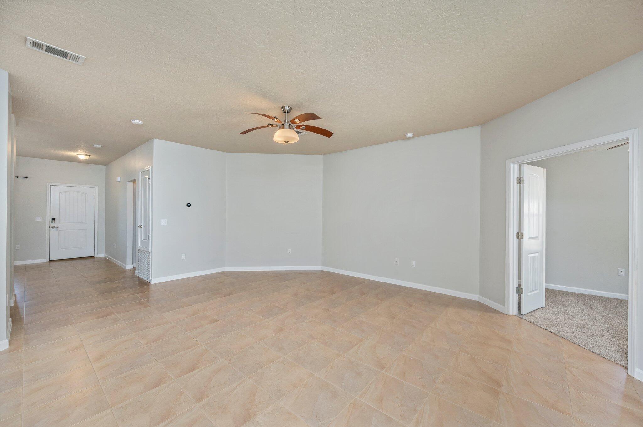 5280 Moore Loop Crestview, FL 32536 - Photo 13 of 54 a view of an empty room with a chandelier fan