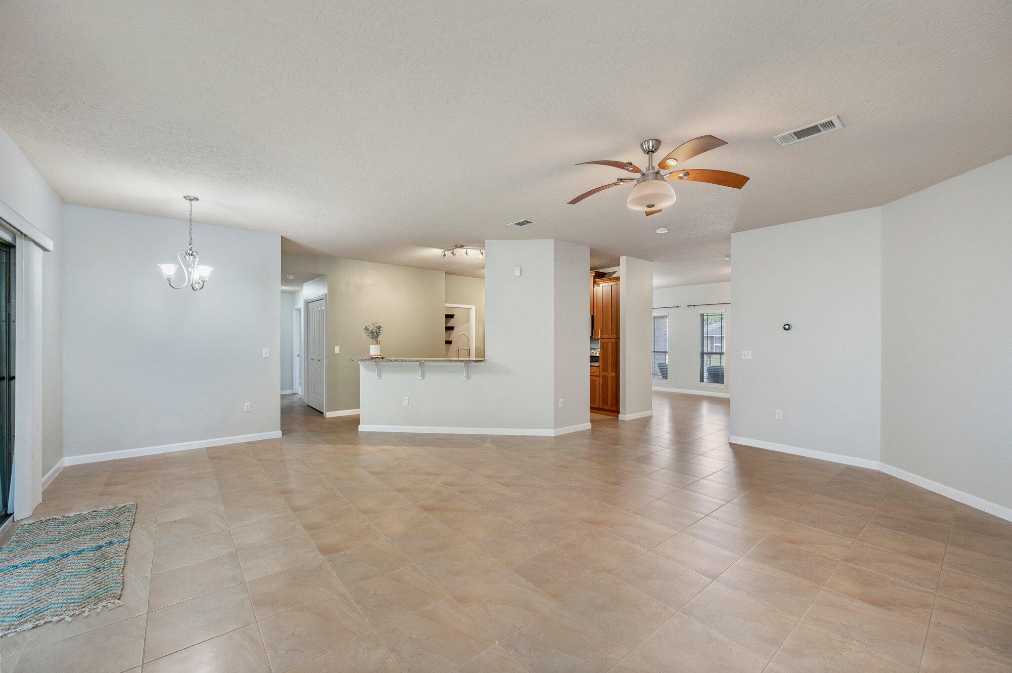 5280 Moore Loop Crestview, FL 32536 - Photo 22 of 54 a view of a kitchen with a sink and a chandelier fan