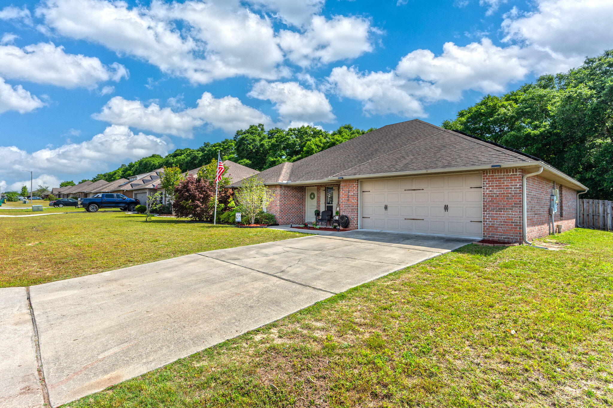5280 Moore Loop Crestview, FL 32536 - Photo 3 of 54 a view of a house with backyard and garden
