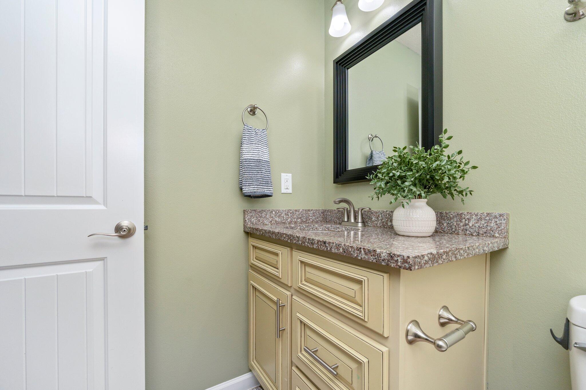 5280 Moore Loop Crestview, FL 32536 - Photo 45 of 54 a bathroom with a granite countertop sink and a mirror