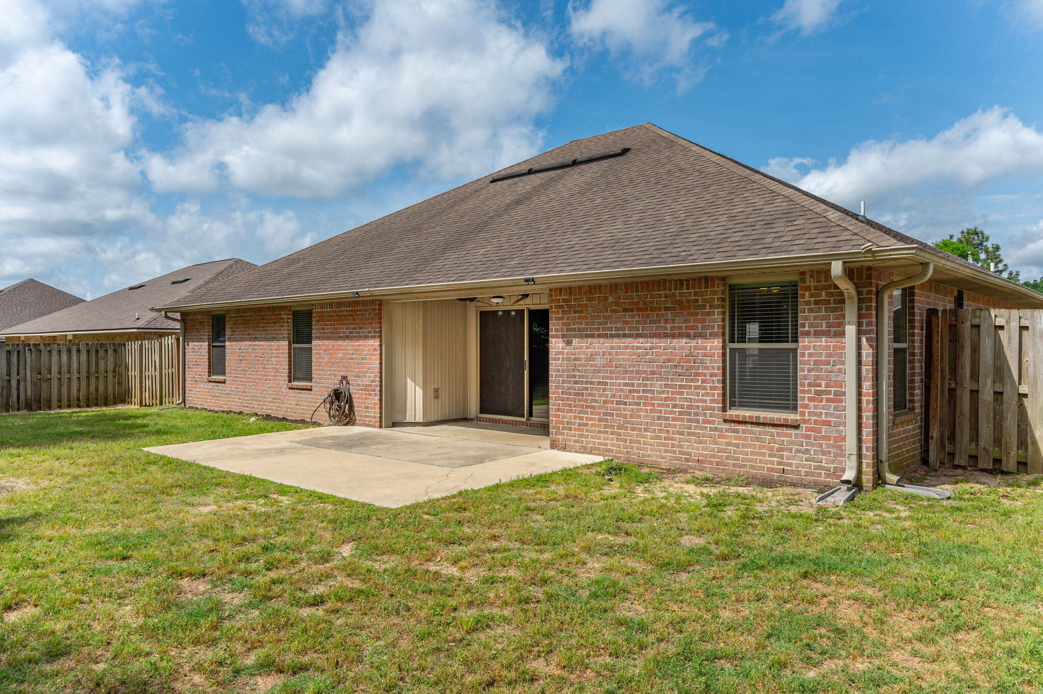 5280 Moore Loop Crestview, FL 32536 - Photo 52 of 54 a front view of a house with garden