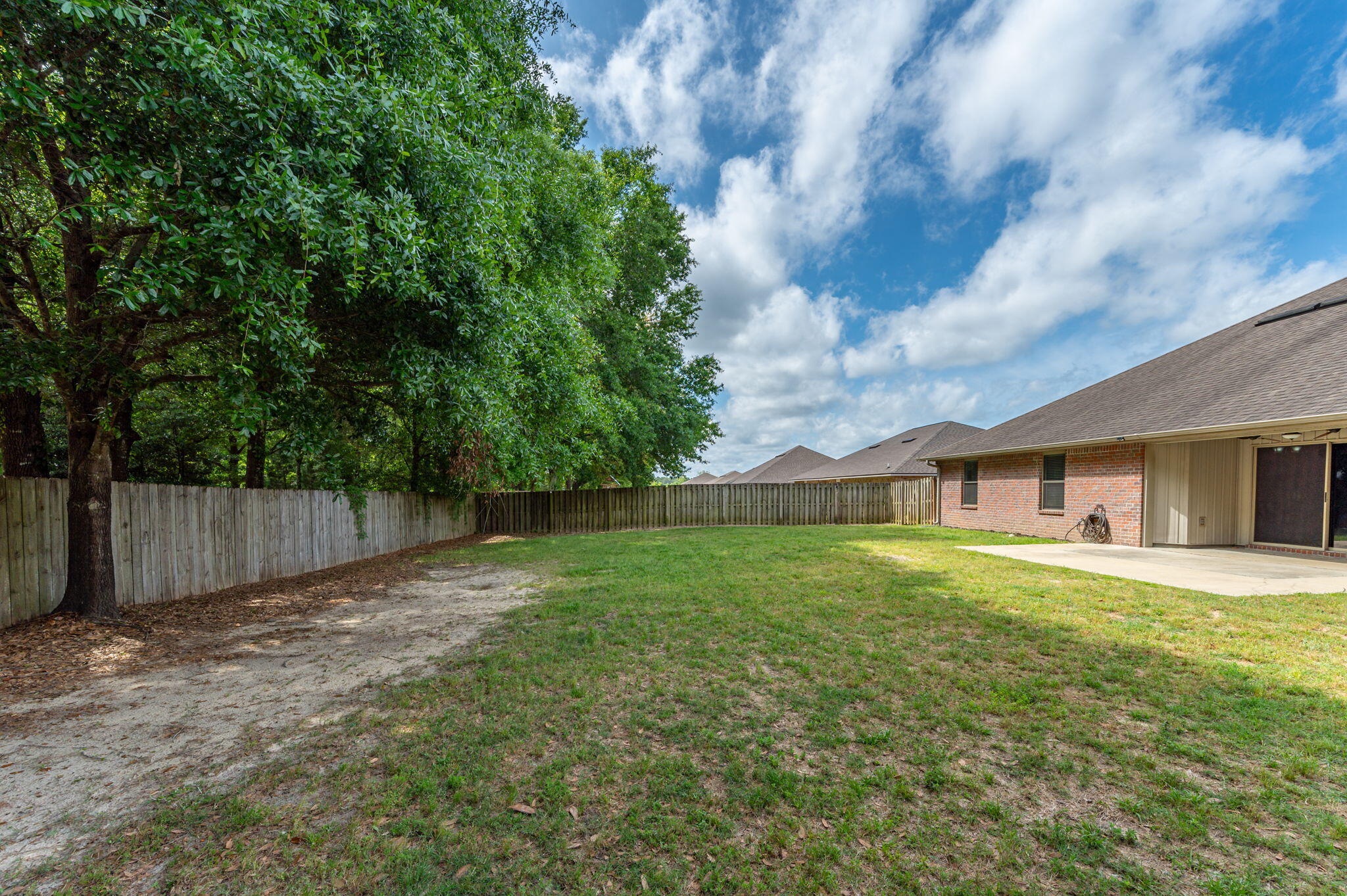 5280 Moore Loop Crestview, FL 32536 - Photo 53 of 54 a view of a yard in front of a house