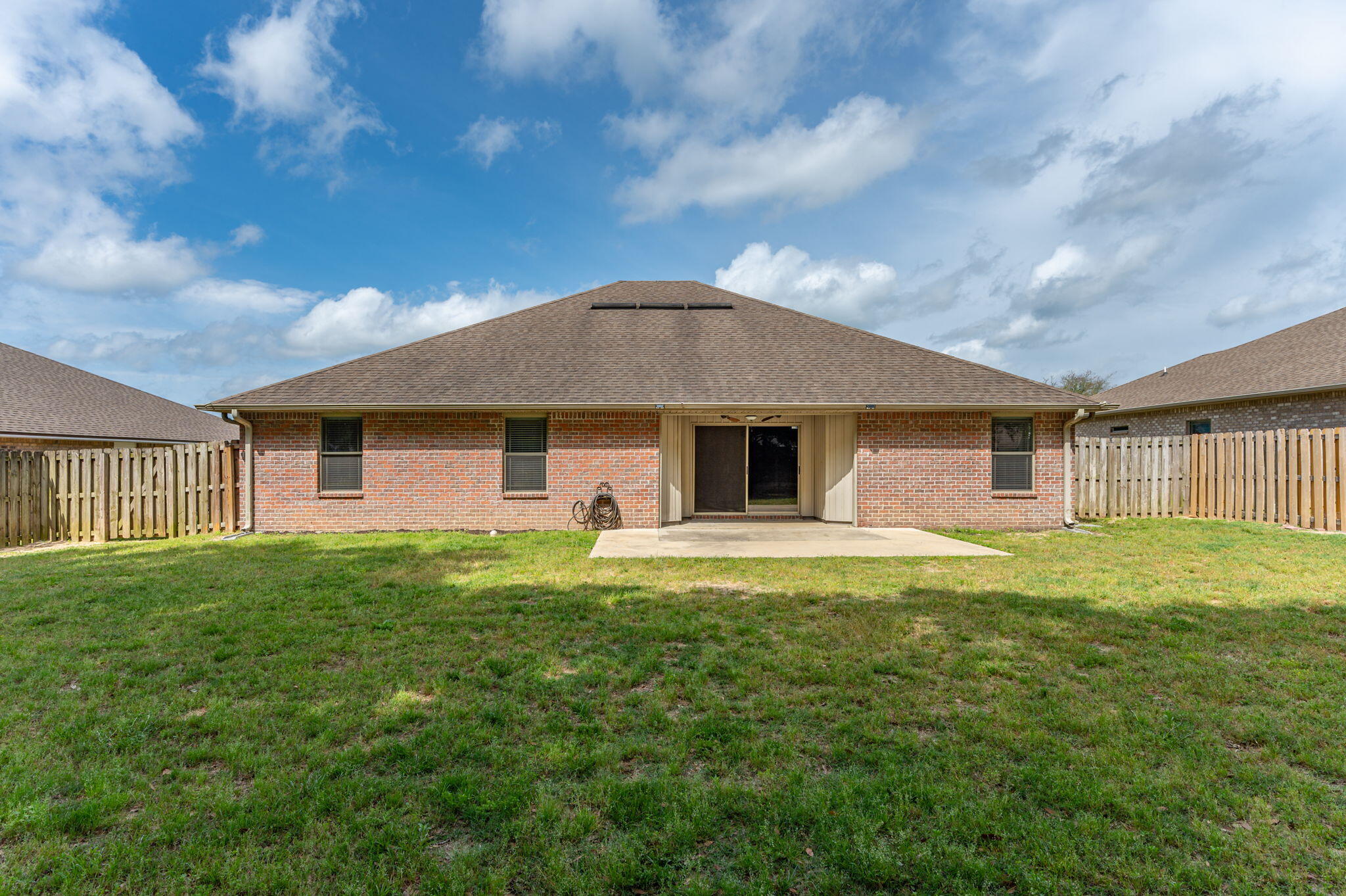 5280 Moore Loop Crestview, FL 32536 - Photo 54 of 54 a front view of a house with a garden